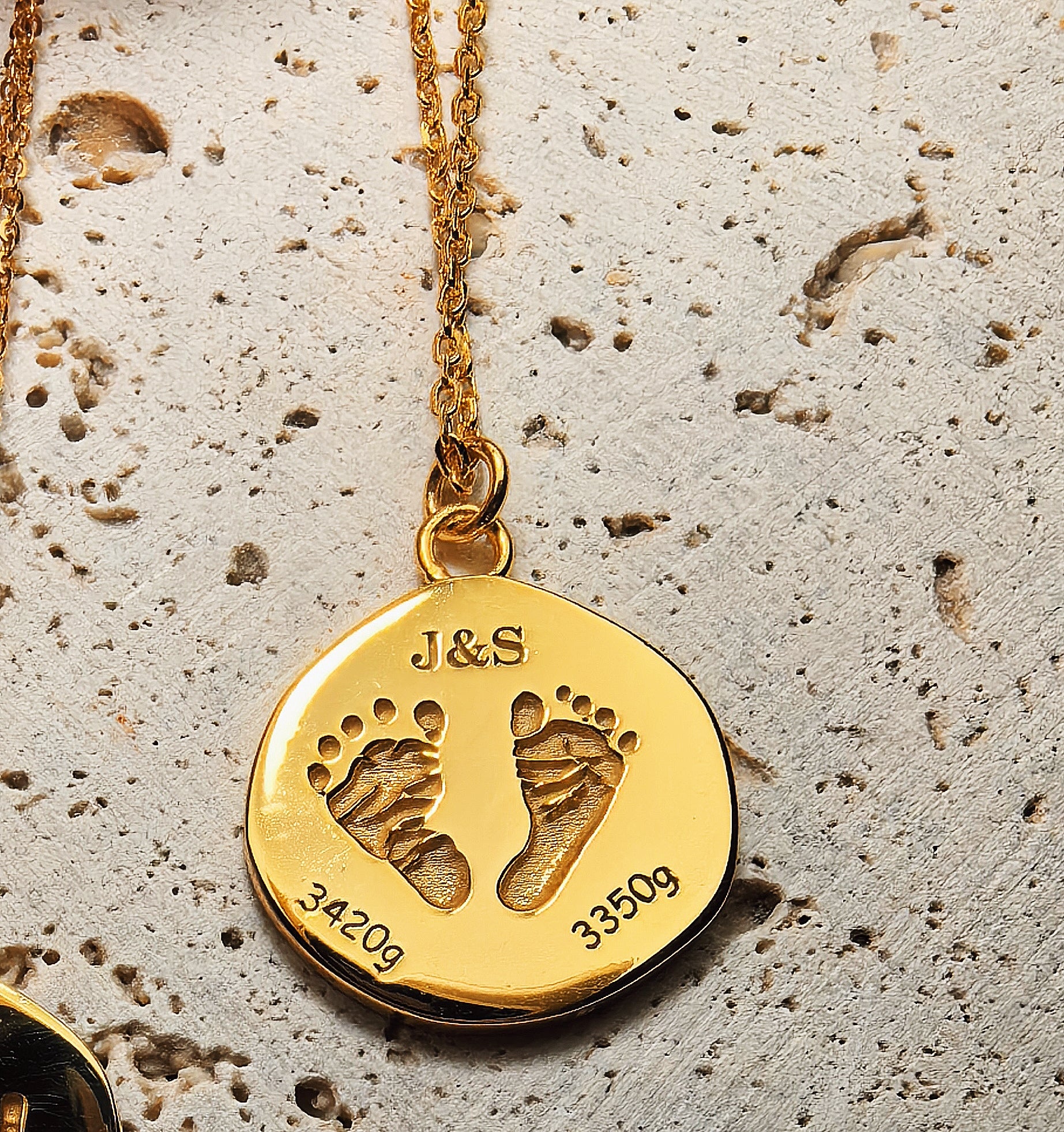 18K Gold Vermeil customized necklace with a pendant featuring footprints and initials with deep engraved and handcrafted surface